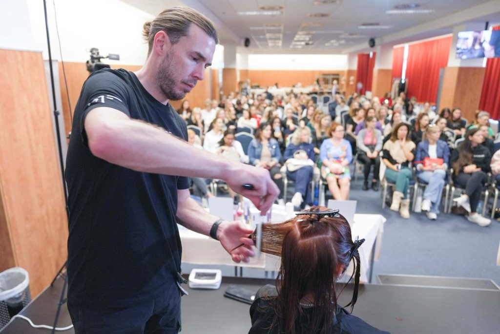 Paul teaching a live course in front of a large audience